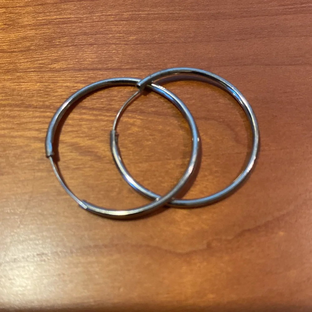 10 pairs of silver tone earrings